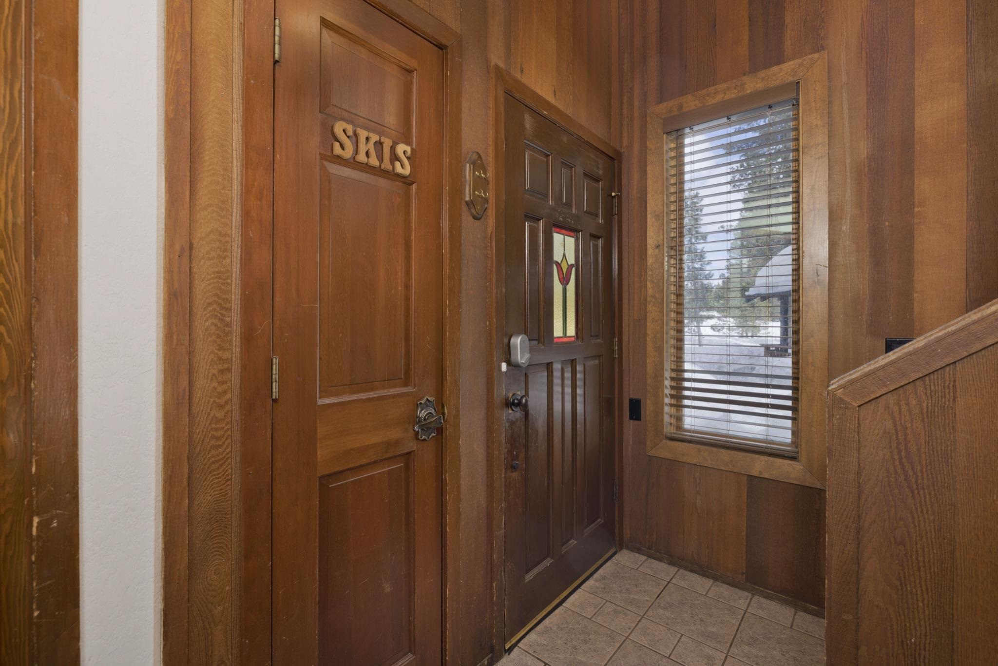 3005 Meridian Boulevard, Unit 47 Mammoth Lakes, CA 93546 - Photo 17 of 40 a view of a hallway with a door and wooden door