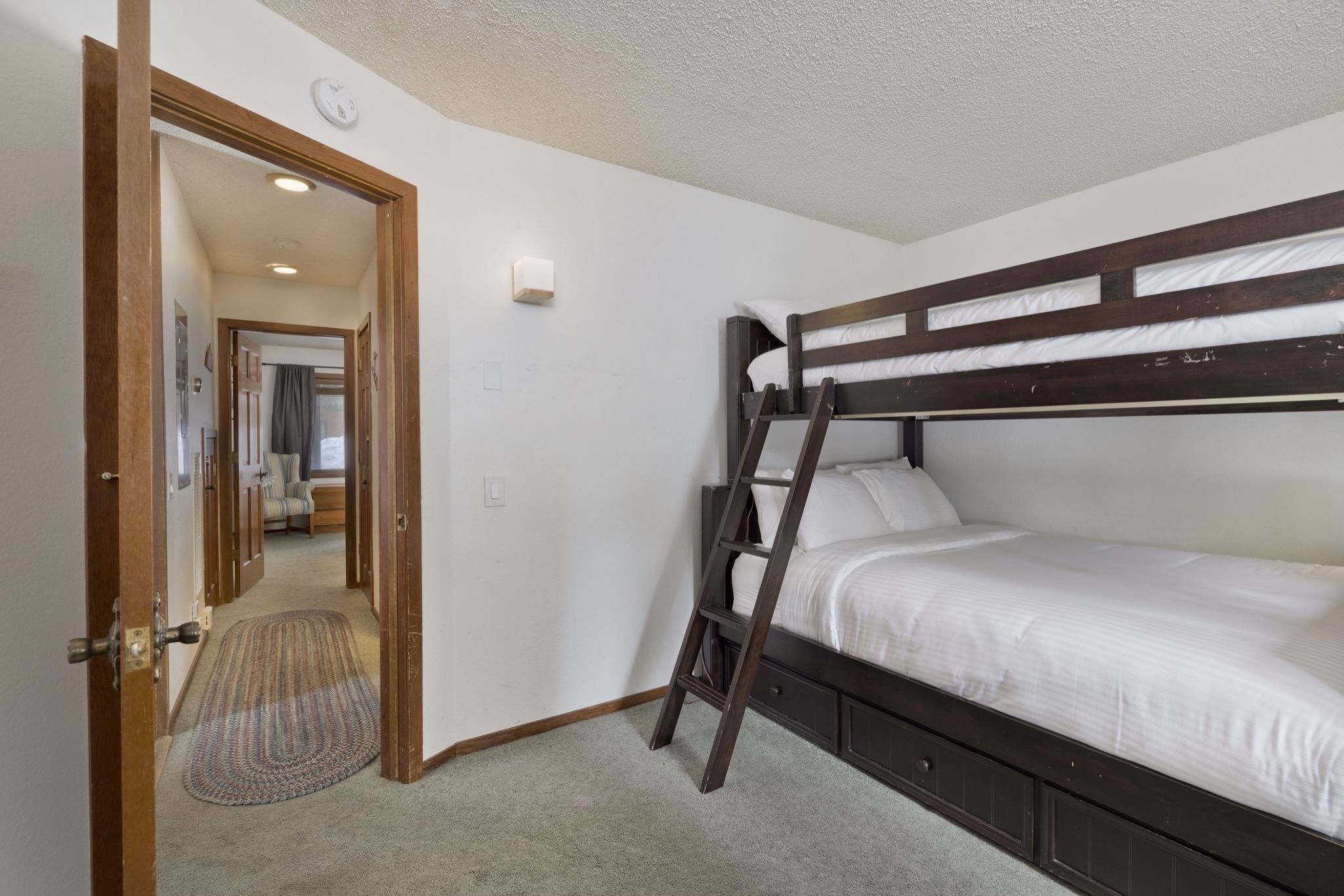 3005 Meridian Boulevard, Unit 47 Mammoth Lakes, CA 93546 - Photo 20 of 40 a bedroom with a bed and a mirror