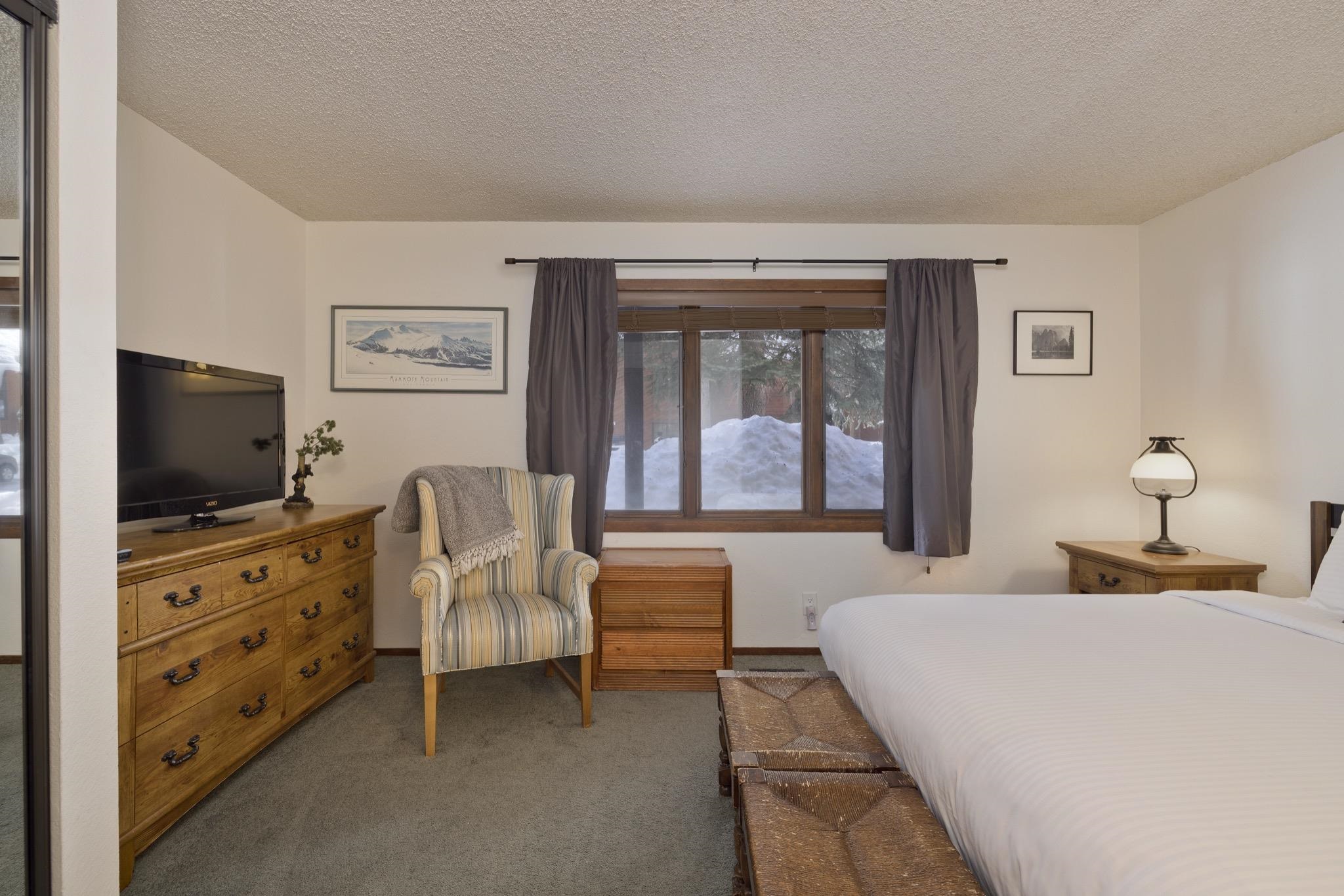 3005 Meridian Boulevard, Unit 47 Mammoth Lakes, CA 93546 - Photo 24 of 40 a bedroom with furniture and a flat screen tv
