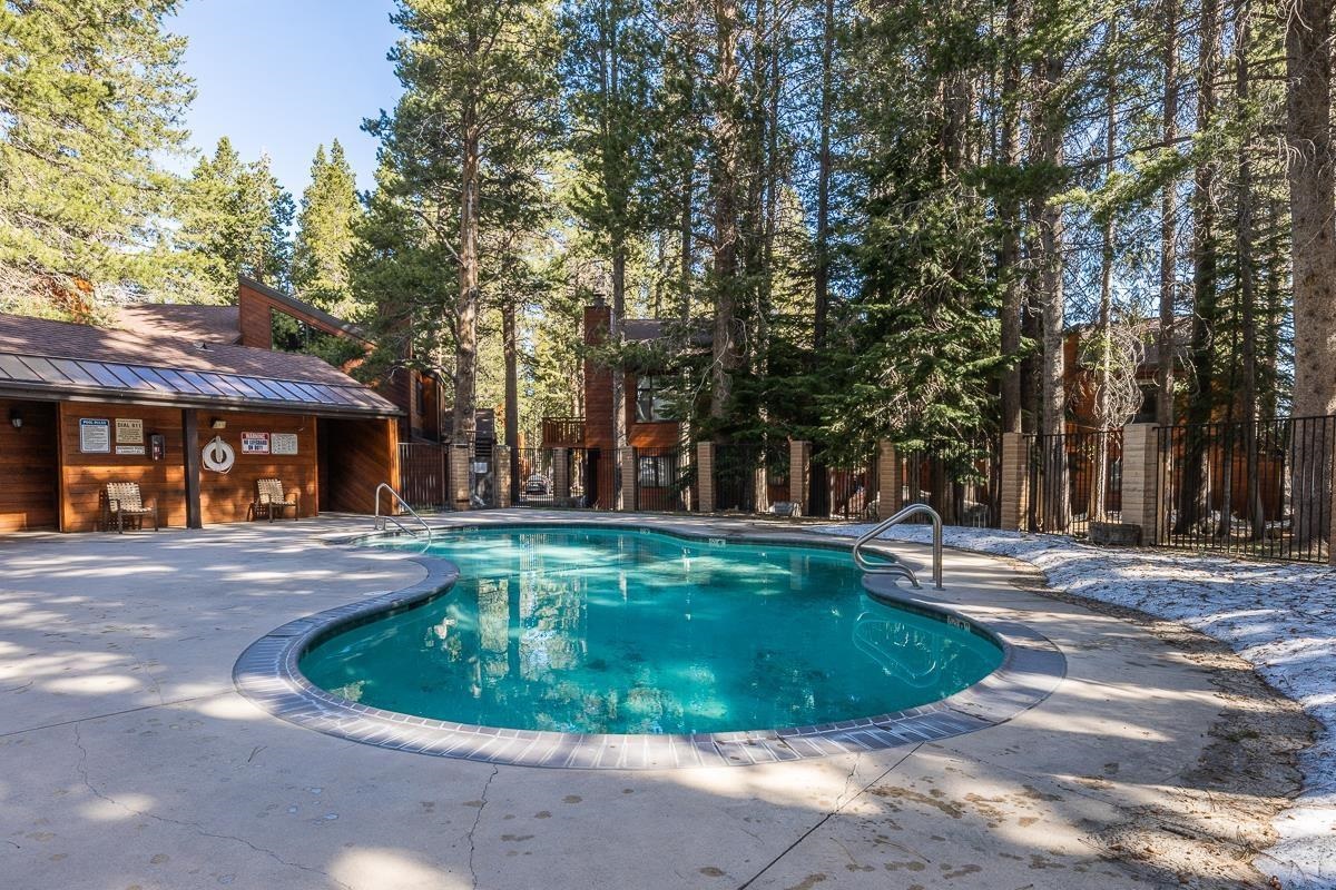 3005 Meridian Boulevard, Unit 47 Mammoth Lakes, CA 93546 - Photo 30 of 40 a view of a swimming pool with a backyard