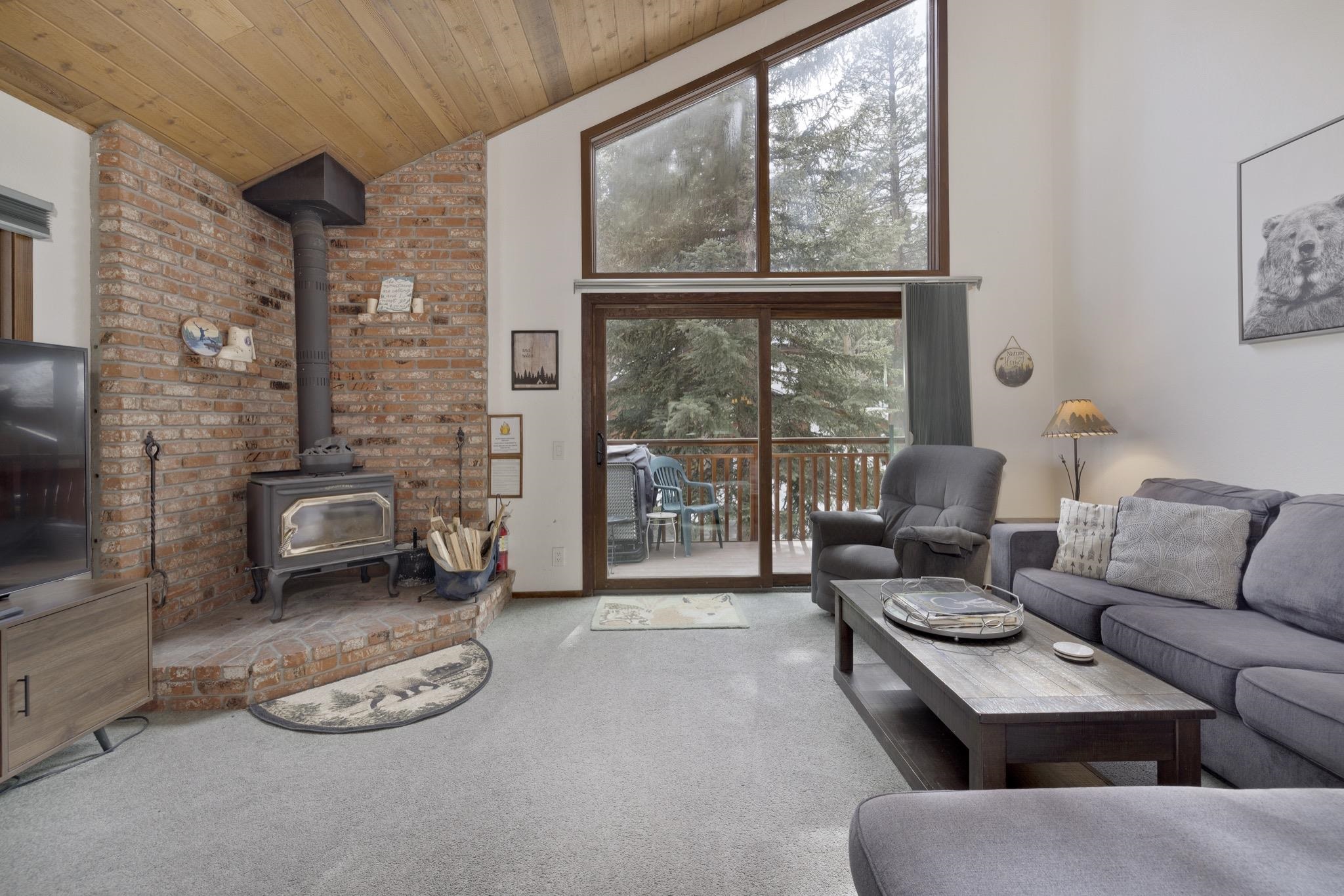 3005 Meridian Boulevard, Unit 47 Mammoth Lakes, CA 93546 - Photo 3 of 40 a living room with furniture and a floor to ceiling window