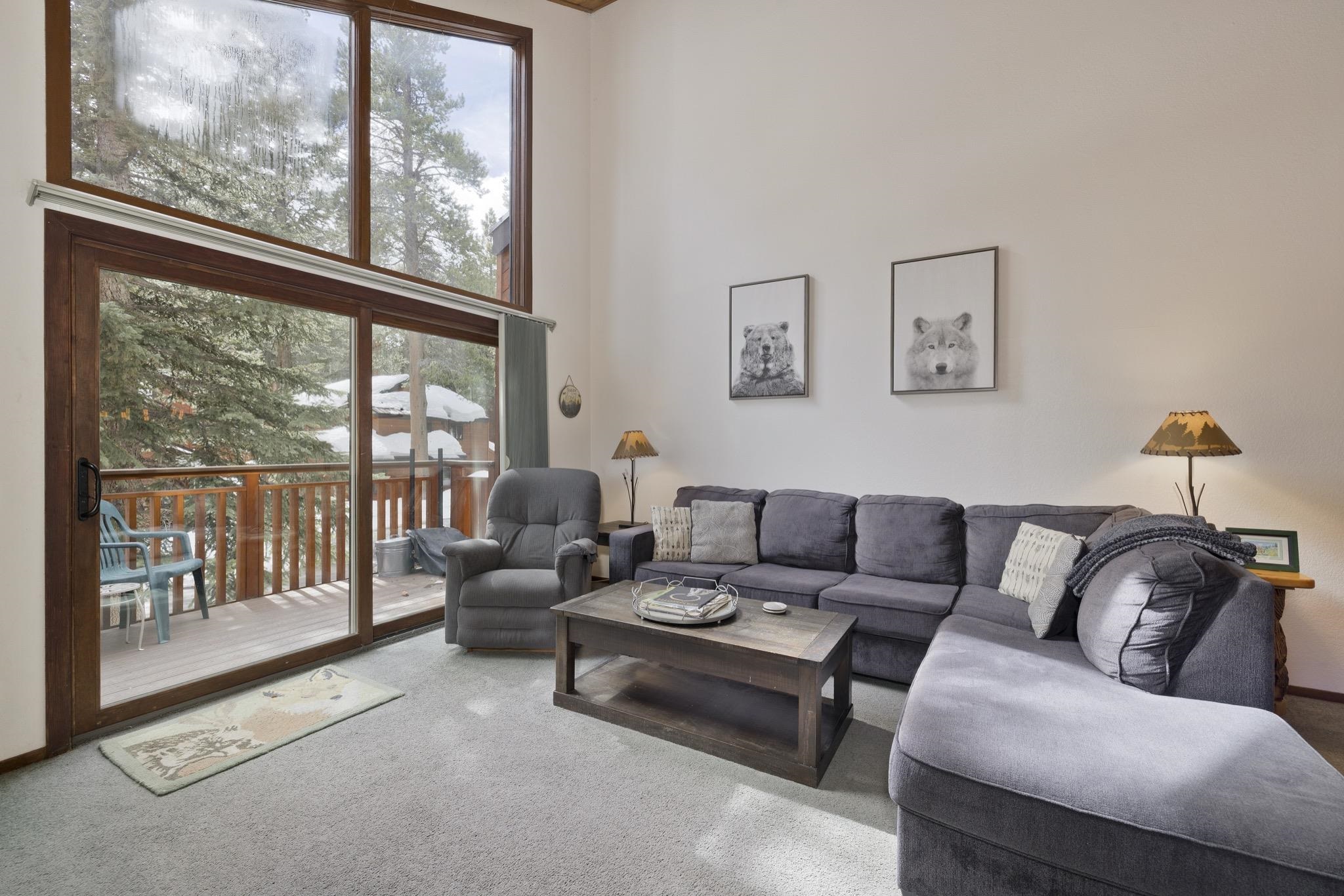 3005 Meridian Boulevard, Unit 47 Mammoth Lakes, CA 93546 - Photo 4 of 40 a living room with furniture and a large window