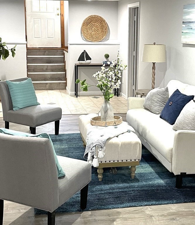 13 Ledge Road Norton, MA 02766 - Photo 14 of 22 a living room with furniture and a mirror