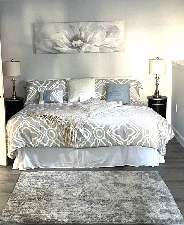 13 Ledge Road Norton, MA 02766 - Photo 15 of 22 a bedroom with a bed and wooden floor