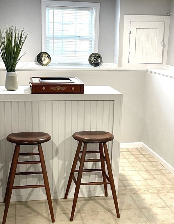 13 Ledge Road Norton, MA 02766 - Photo 17 of 22 a view of entryway with a potted plant and wooden floor