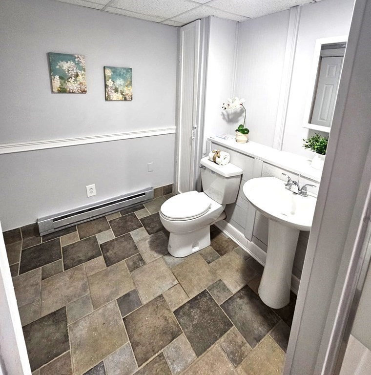 13 Ledge Road Norton, MA 02766 - Photo 18 of 22 a bathroom with a toilet a sink and shower