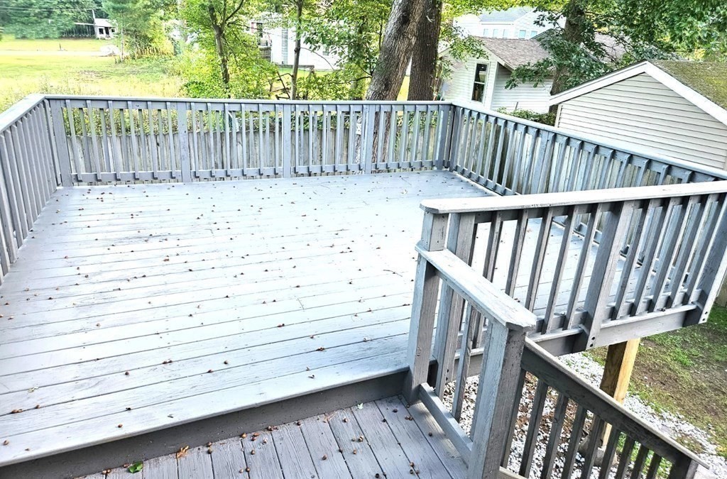 13 Ledge Road Norton, MA 02766 - Photo 22 of 22 a view of wooden deck with large trees and wooden fence