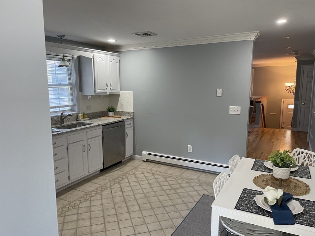 13 Ledge Road Norton, MA 02766 - Photo 5 of 22 a kitchen with a sink cabinets and appliances