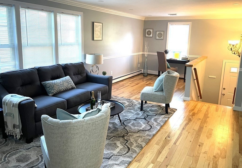 13 Ledge Road Norton, MA 02766 - Photo 7 of 22 a living room with furniture and a table
