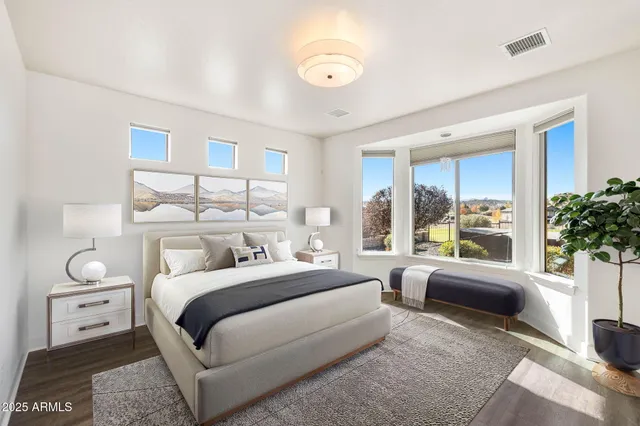 a bathroom with a granite countertop sink two mirror and shower