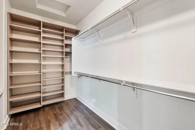 a view of a kitchen with wooden cabinets