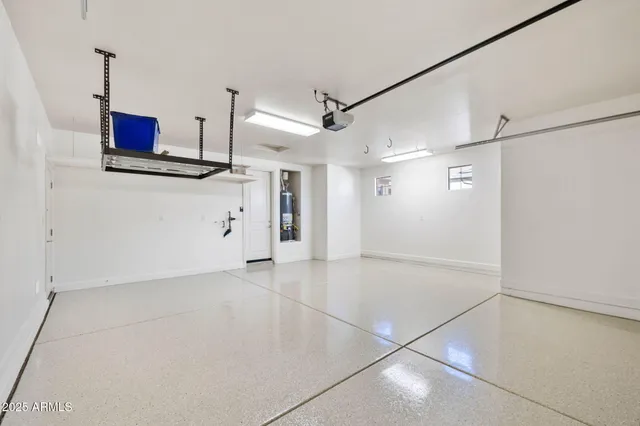 a bathroom with a granite countertop sink a toilet a mirror and shower