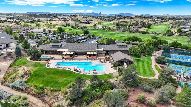 a view of a sign board with flower around
