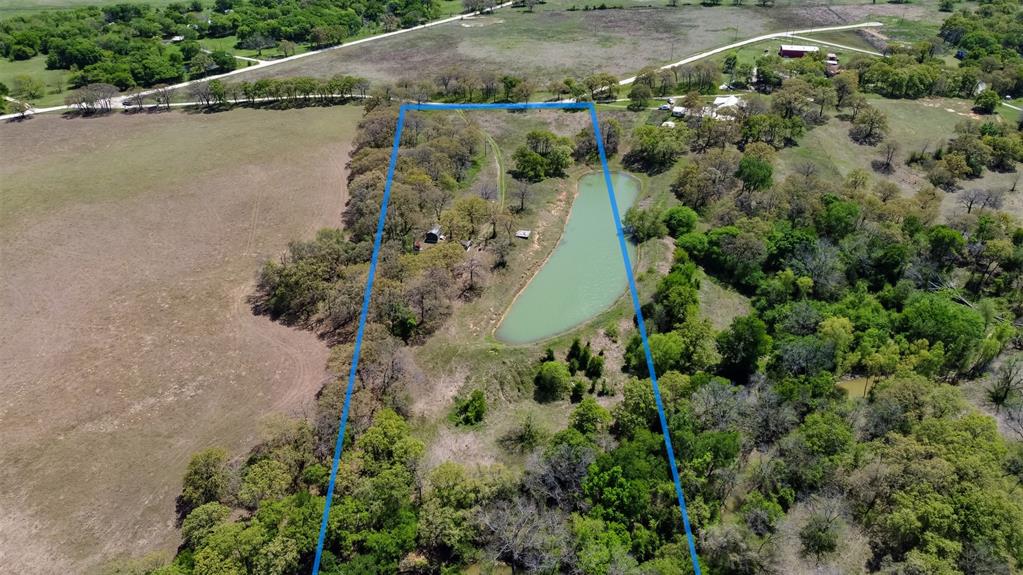 247 Private Road Covington, TX 76636 - Photo 34 of 38 Drone / aerial view with a rural view and a water view