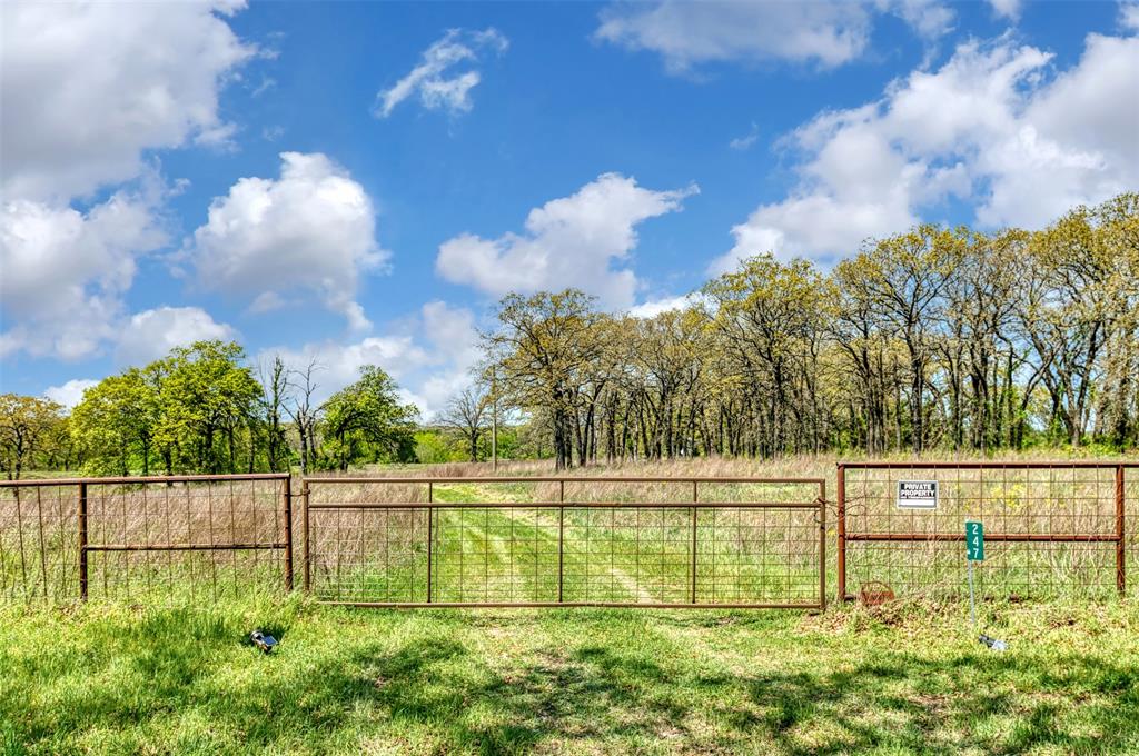 247 Private Road Covington, TX 76636 - Photo 7 of 38 View of gate featuring a rural view and fence