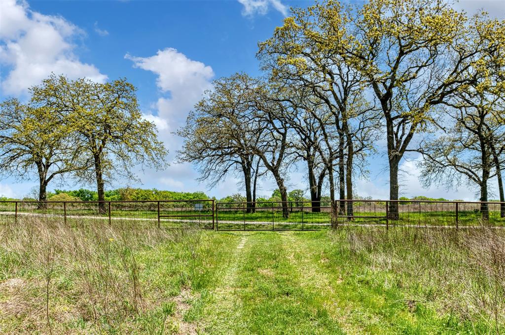 247 Private Road Covington, TX 76636 - Photo 9 of 38 View of yard featuring a rural view and fence
