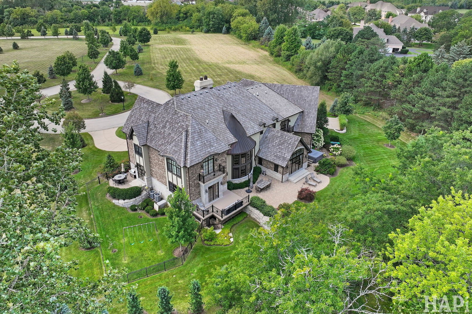 18 Enclave South Barrington, IL 60010 - Photo 4 of 5 an aerial view of a house with yard and outdoor seating