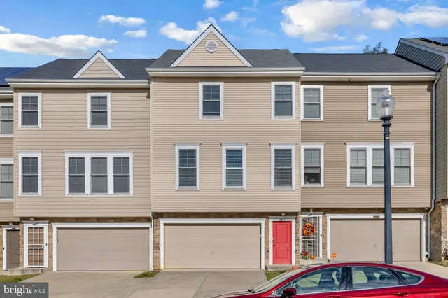 a front view of residential houses with street