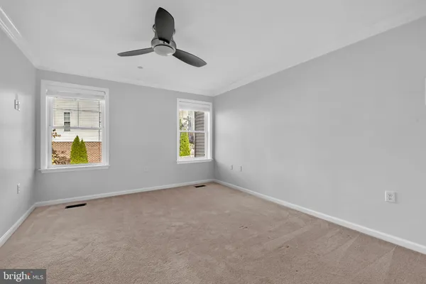 a view of hallway with wooden floor