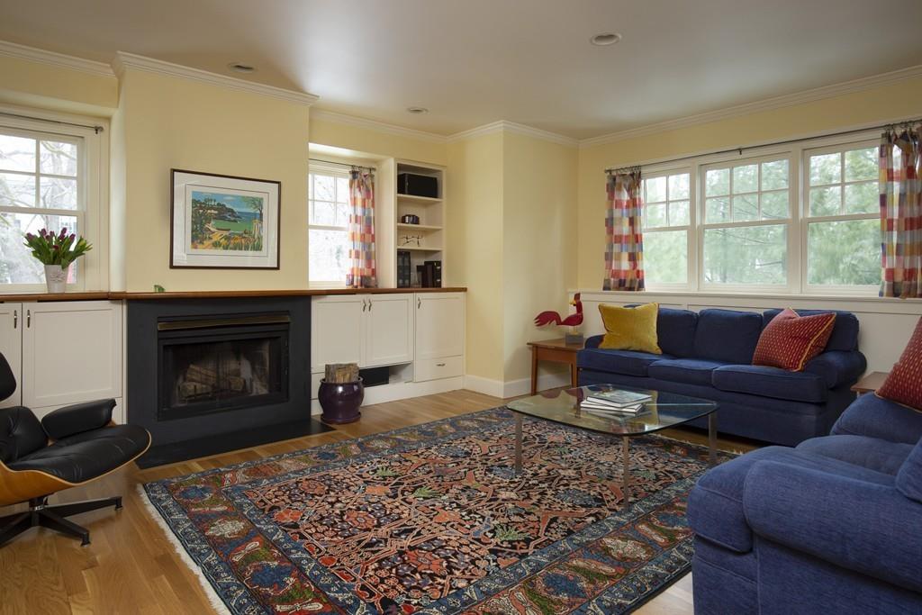 7 Locust Road Weston, MA 02493 - Photo 4 of 13 a living room with furniture windows and a fireplace