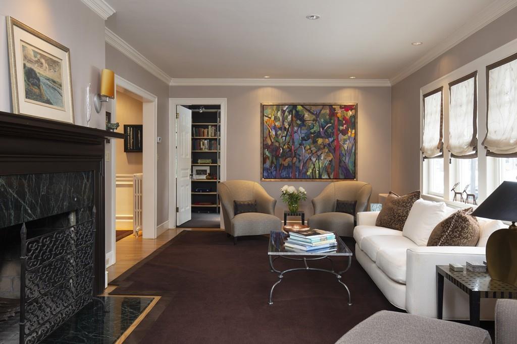7 Locust Road Weston, MA 02493 - Photo 5 of 13 a living room with furniture two windows and a fireplace