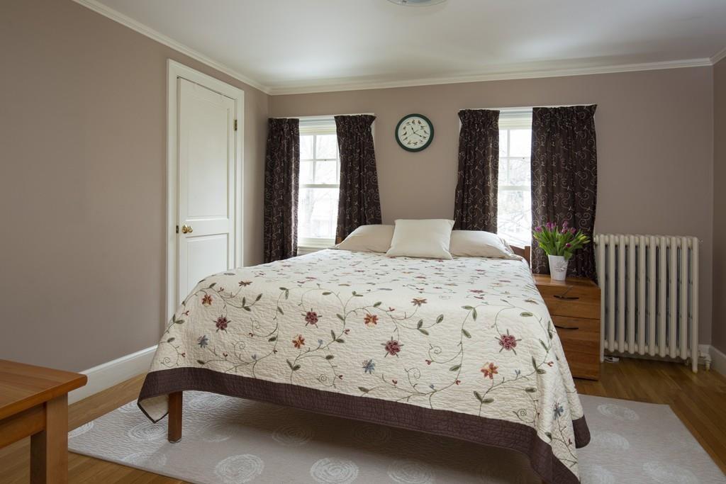 7 Locust Road Weston, MA 02493 - Photo 9 of 13 a bedroom with a bed and a window