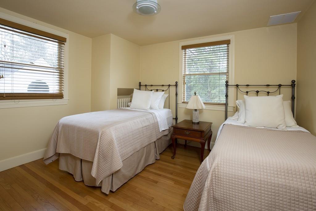 7 Locust Road Weston, MA 02493 - Photo 10 of 13 a bedroom with bed and window