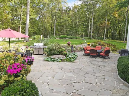 a view of a with chairs and table in the patio
