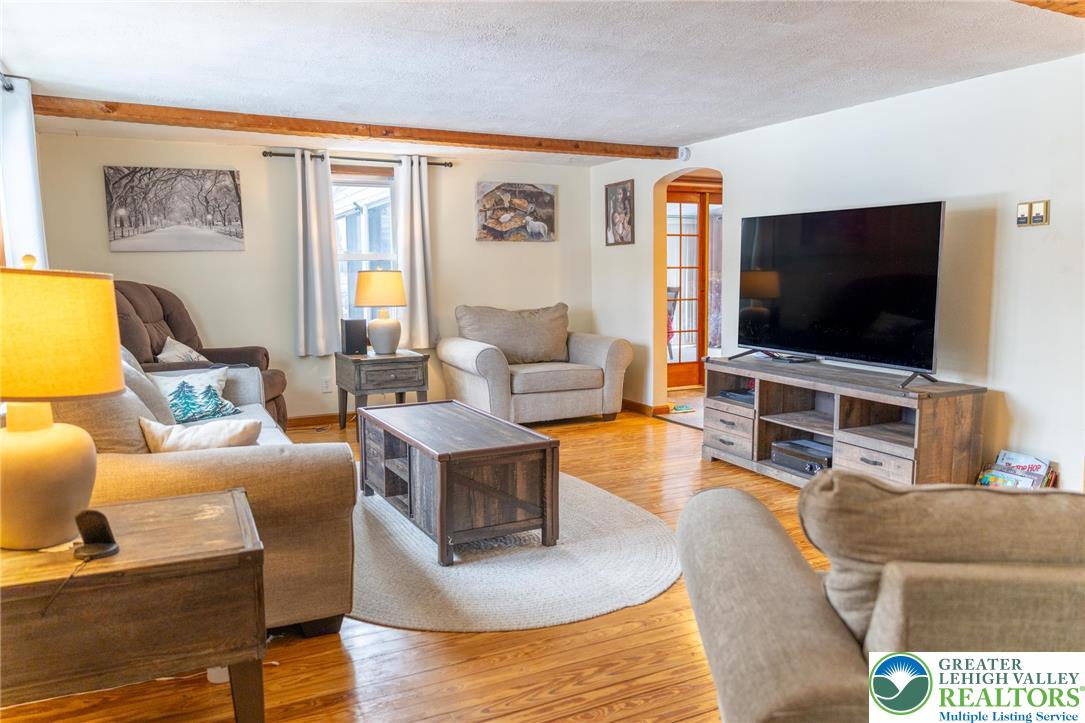 664 Locke Heights Road Bangor, PA 18013 - Photo 2 of 20 a living room with furniture and a flat screen tv