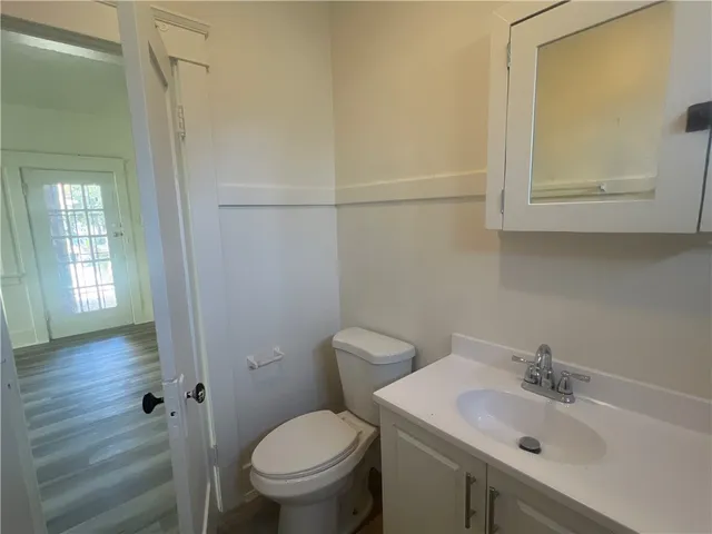 a kitchen with granite countertop a stove and a refrigerator