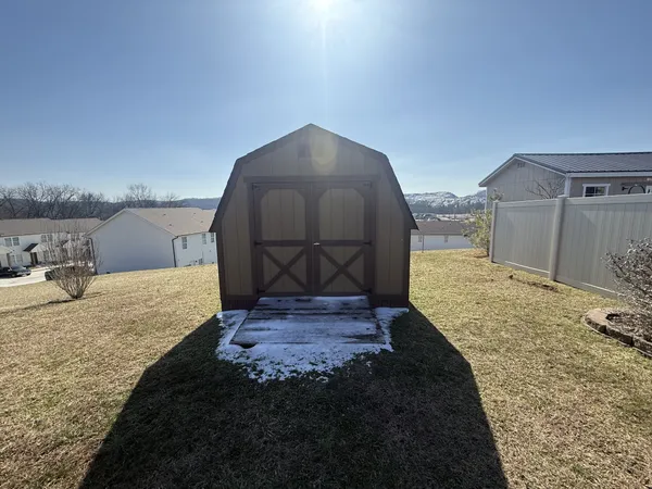 a view of a backyard of a house