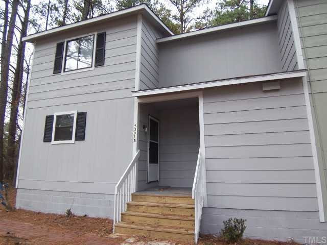 7301 Leesville Road, Unit ABCD Raleigh, NC 27613 - Photo 8 of 8 a view of a house with a garage