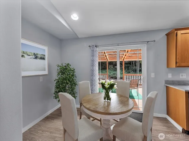 a kitchen with sink cabinets and wooden floor
