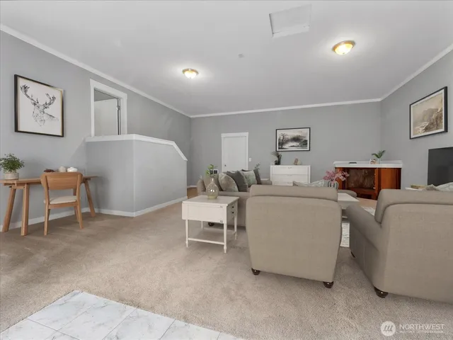 a living room with furniture and a lamp