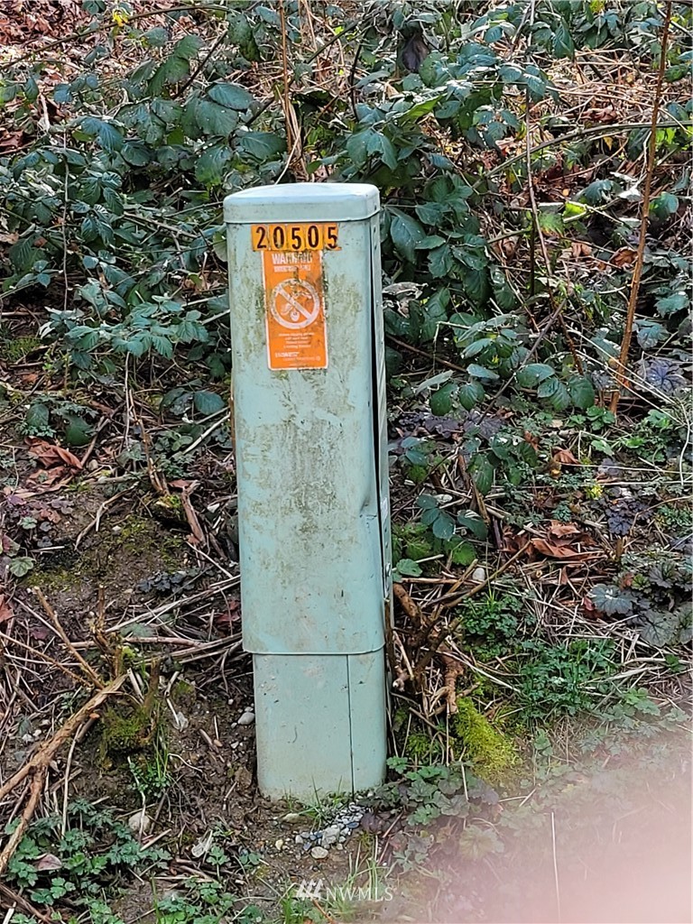 20109 Southeast Petrovitsky Road Maple Valley, WA 98038 - Photo 17 of 24 a sign that is sitting on a brick wall