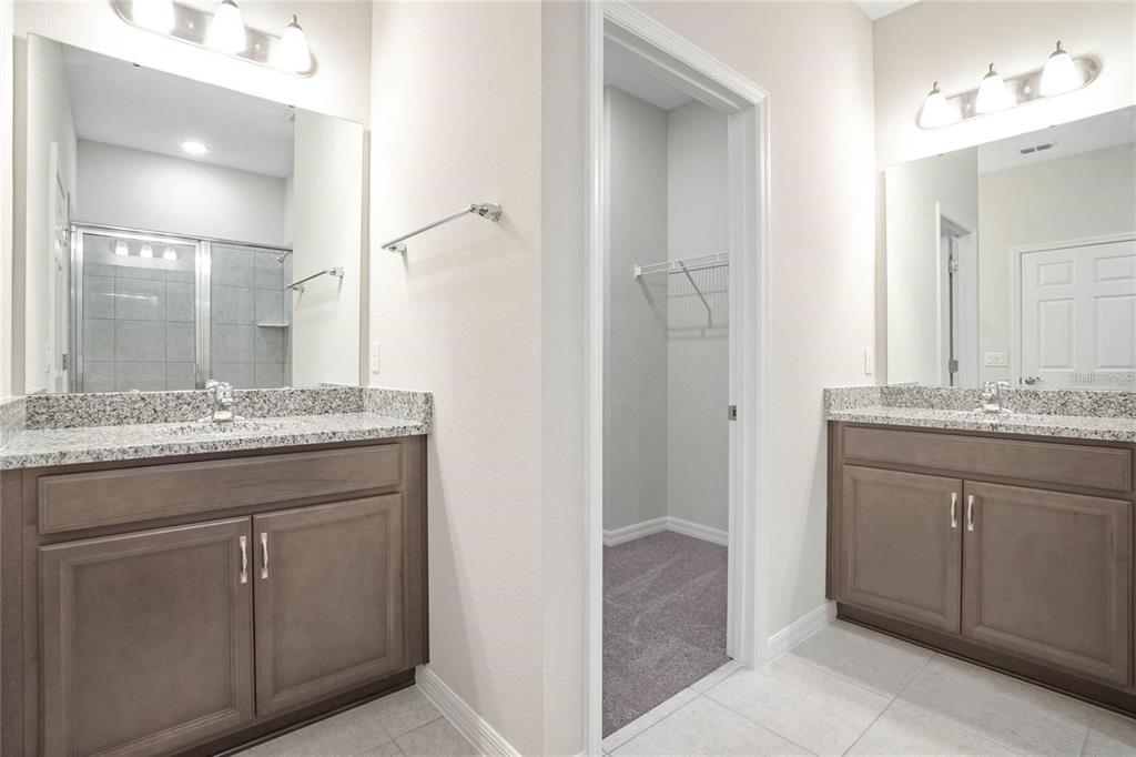 715 Poller Way Cocoa, FL 32927 - Photo 16 of 19 a bathroom with a granite countertop sink and a mirror