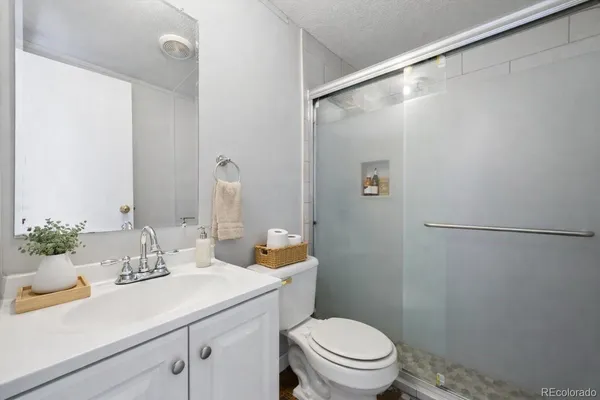 a bathroom with a sink a mirror and a toilet