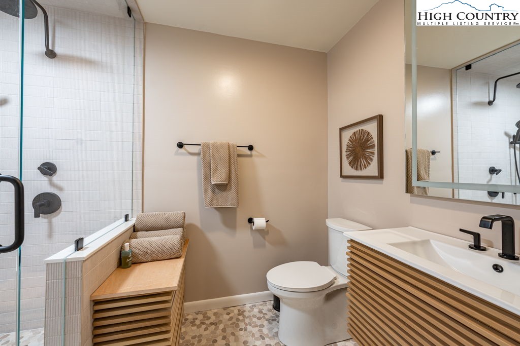 102 Ridge Drive Linville, NC 28646 - Photo 28 of 48 a bathroom with a sink toilet and shower