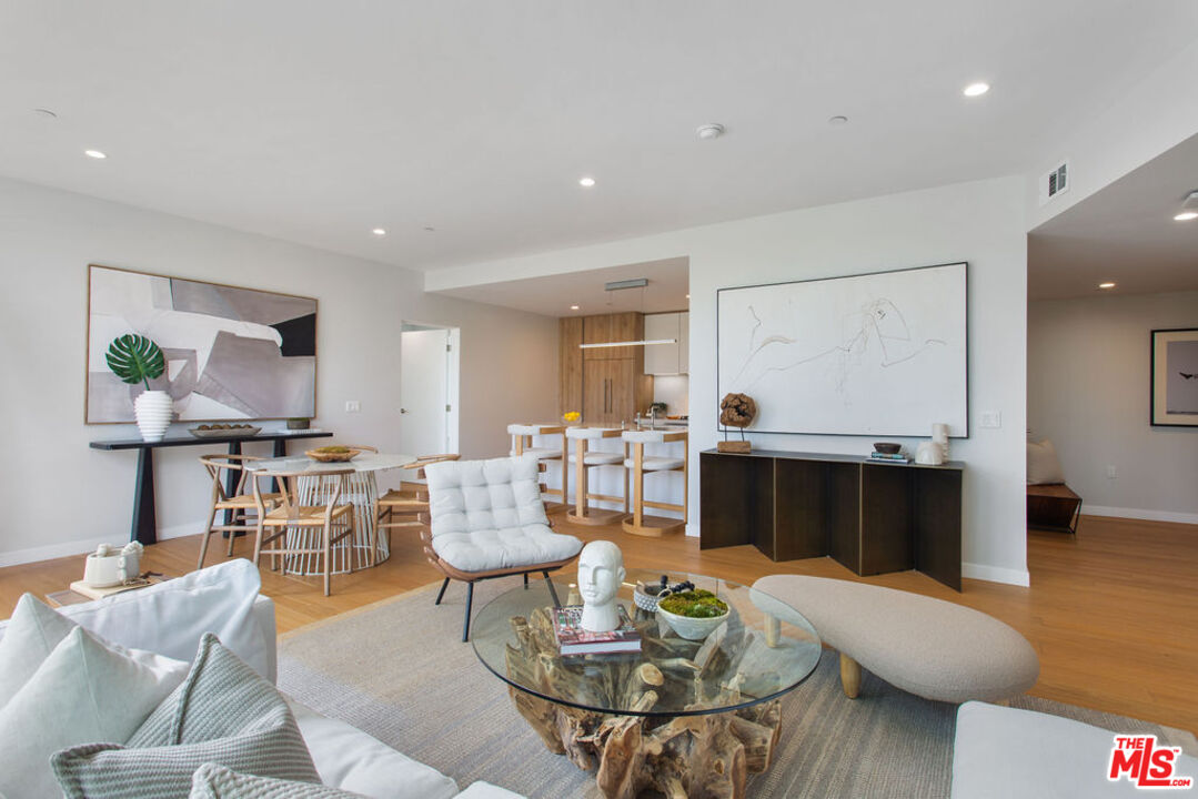 11600 Dunstan Way, Unit 404 Los Angeles, CA 90049 - Photo 1 of 28 a living room with furniture and wooden floor