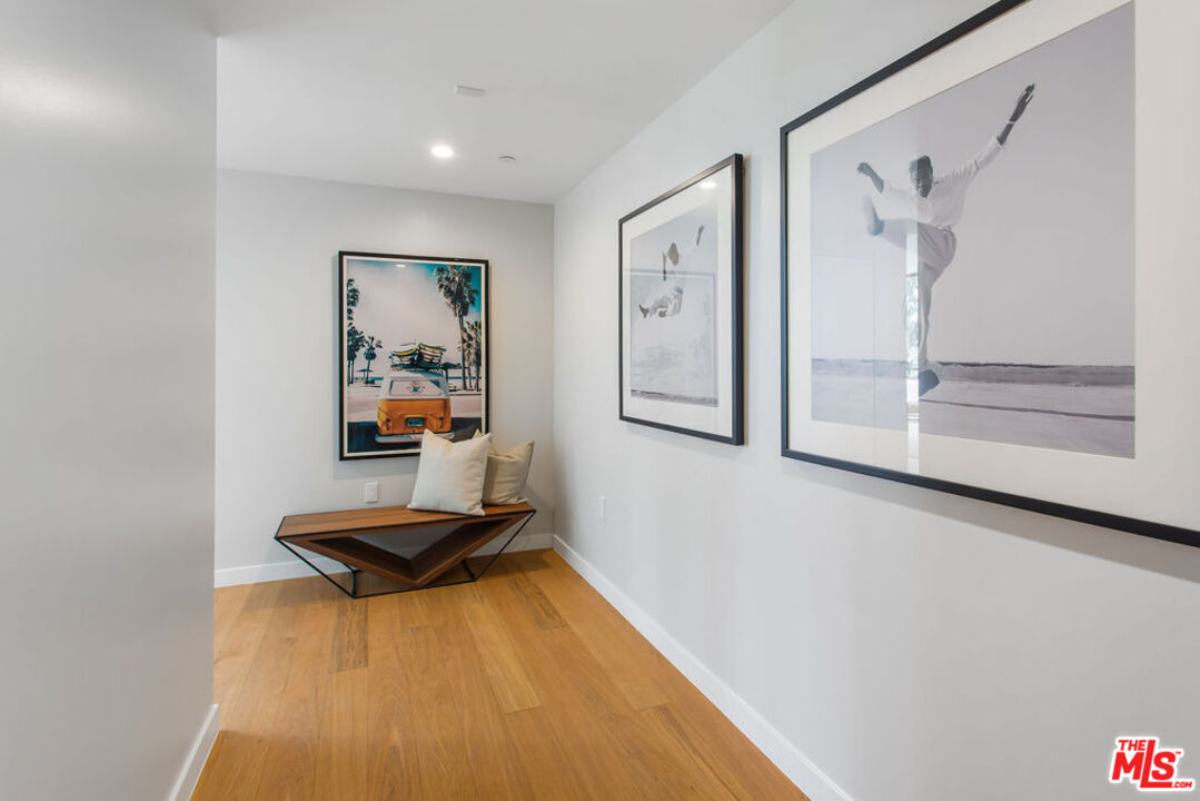 11600 Dunstan Way, Unit 404 Los Angeles, CA 90049 - Photo 27 of 28 a living room with furniture and wooden floor