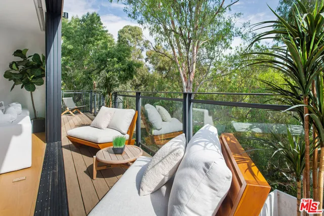 a view of swimming pool with a patio and a garden