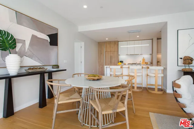 a view of a dining room with furniture and a table