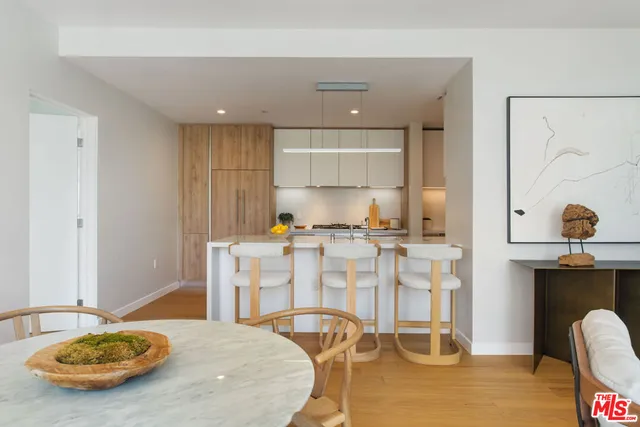 a kitchen with stainless steel appliances granite countertop a sink and cabinets