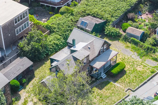 an aerial view of residential house with outdoor space and swimming pool