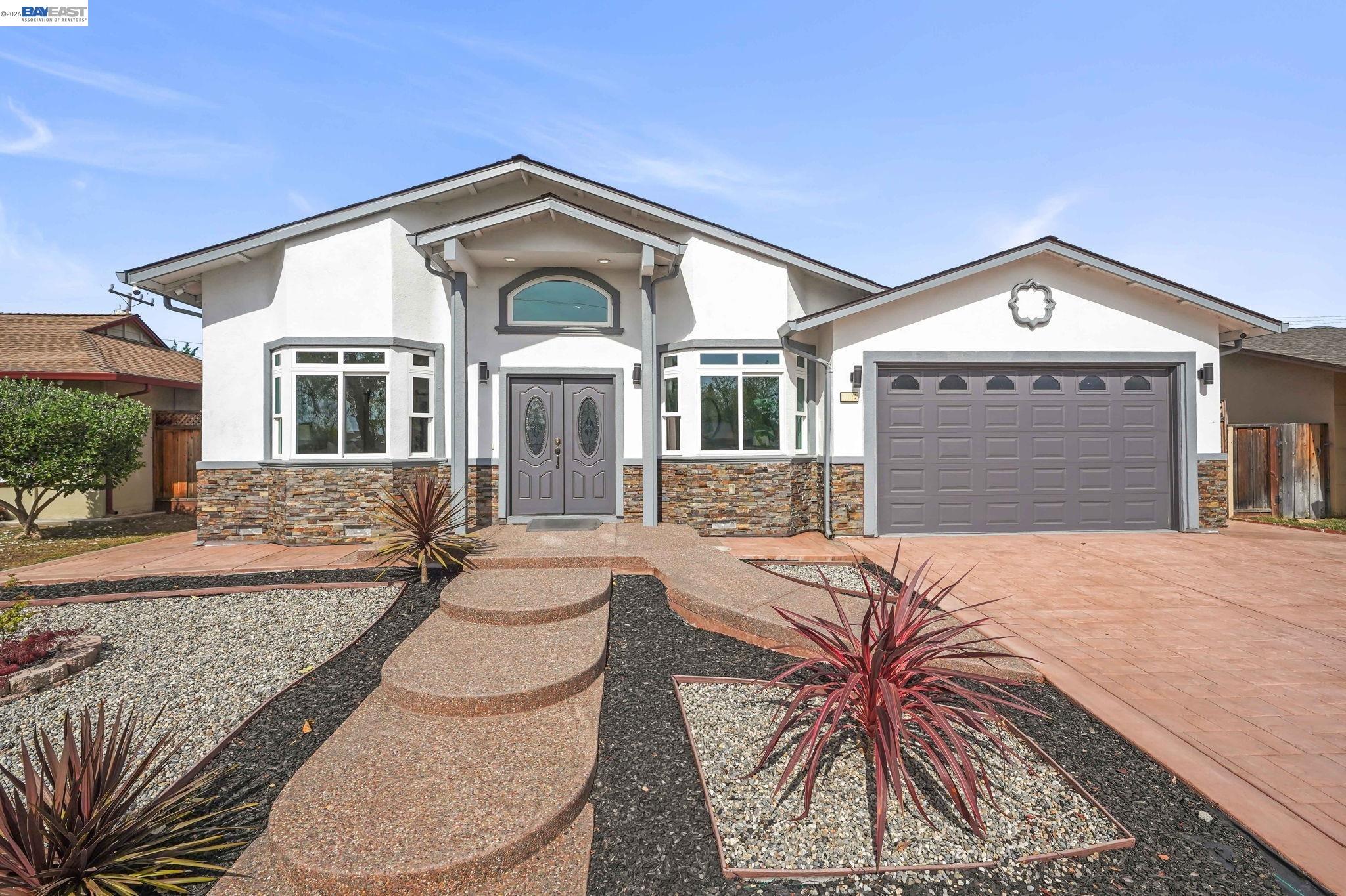 40772 Blacow Road Fremont, CA 94538 - Photo 4 of 40 a front view of a house with a yard