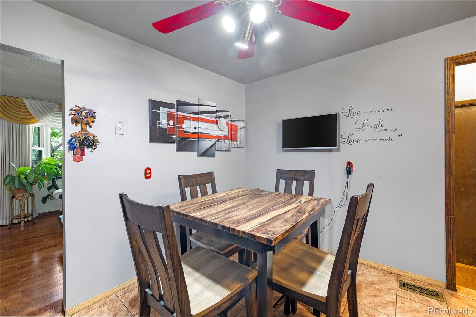 5311 Troy Street Denver, CO 80239 - Photo 13 of 46 a view of a dining room with furniture