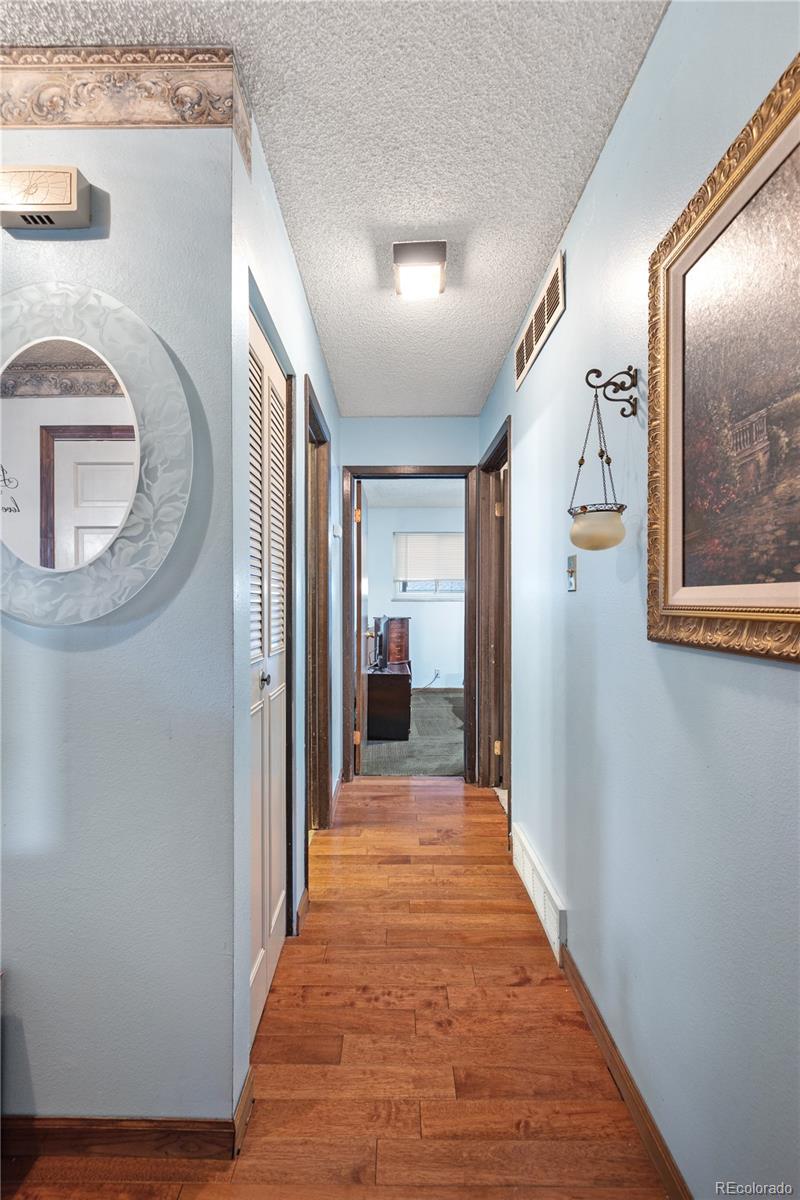 5311 Troy Street Denver, CO 80239 - Photo 14 of 46 a view of a hallway view with staircase