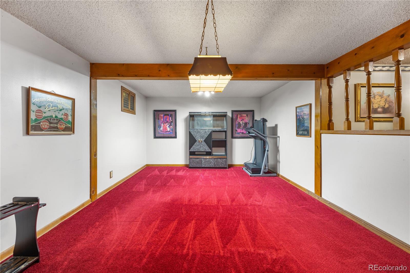5311 Troy Street Denver, CO 80239 - Photo 34 of 46 a view of a room with furniture and window