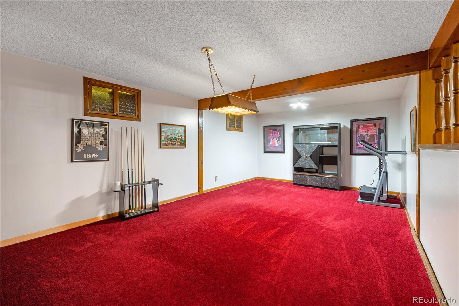 5311 Troy Street Denver, CO 80239 - Photo 35 of 46 a bed room with a bed and a flat screen tv
