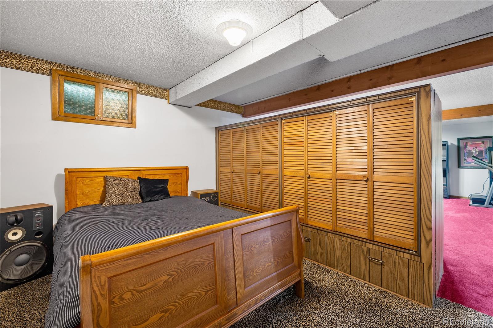 5311 Troy Street Denver, CO 80239 - Photo 39 of 46 a bedroom with a bed and a dresser